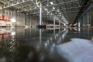 Rainwater stands on the ground at the construction site of the new Cottbus plant. Construction work on the second hall of the new railroad plant has been underway since the beginning of 2024. 