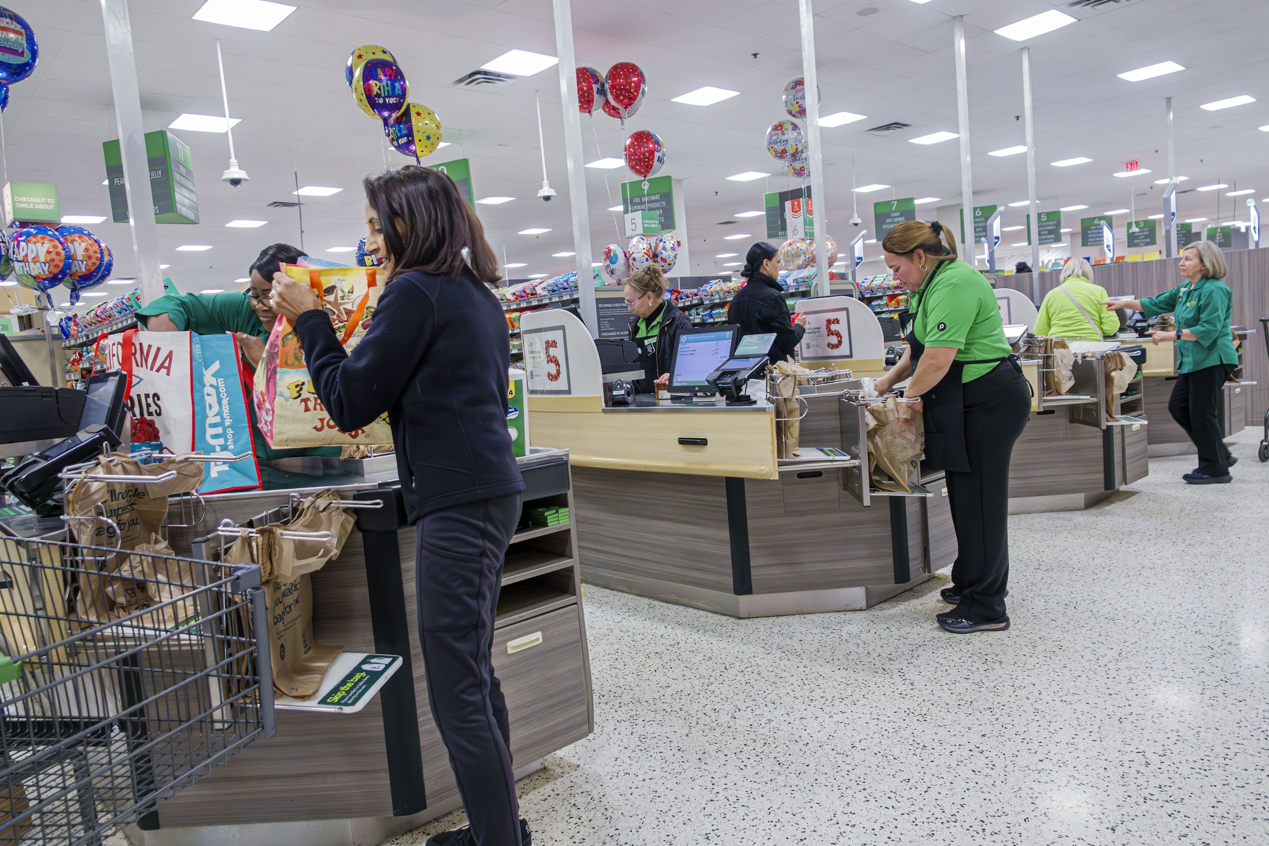Customers at check out in a Publix grocery store in Miami Beach, Florida.