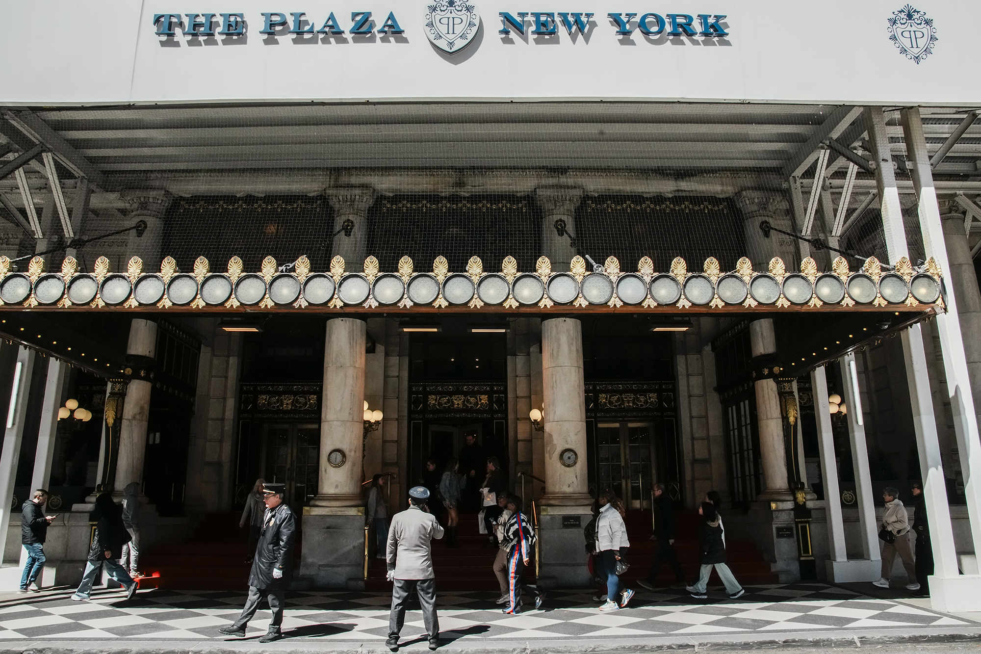People walk in front of the Plaza hotel in April.