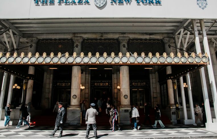 People walk in front of the Plaza hotel in April.