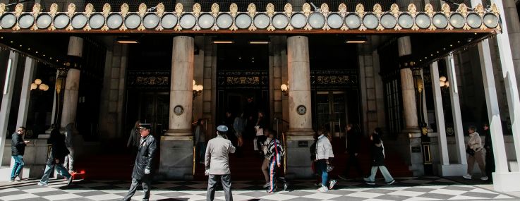 People walk in front of the Plaza hotel in April.