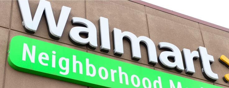 Signs at a Publix and a Walmart Neighborhood Market.