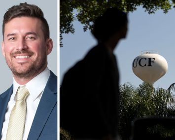 Affinius Capital's Tyler Figley and a student walks past a water tower at the University of Central Florida.