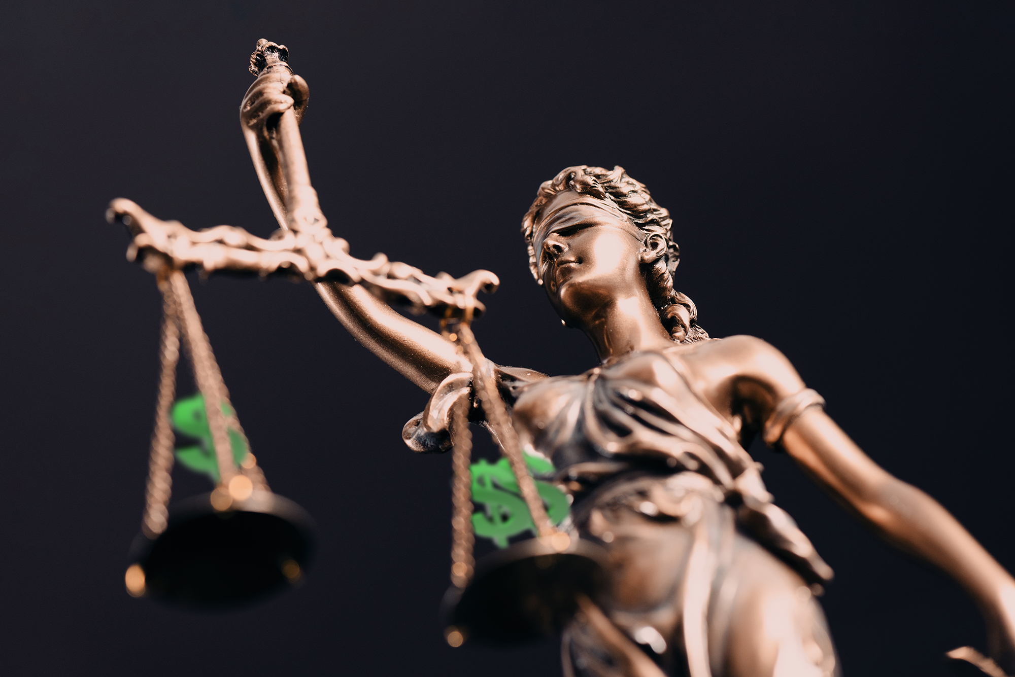 Illustration of Lady Justice holding scales with dollar signs on them.