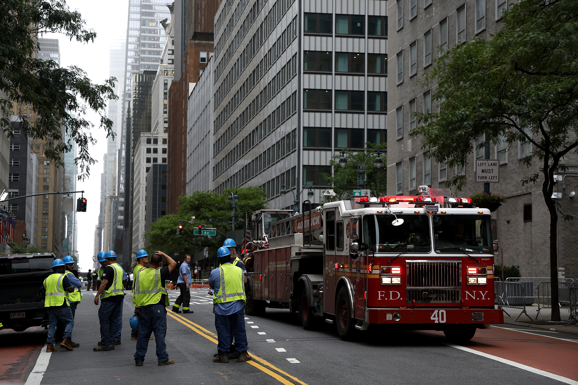 Emergency personnel work near the former Pfizer headquarters building on July 7.