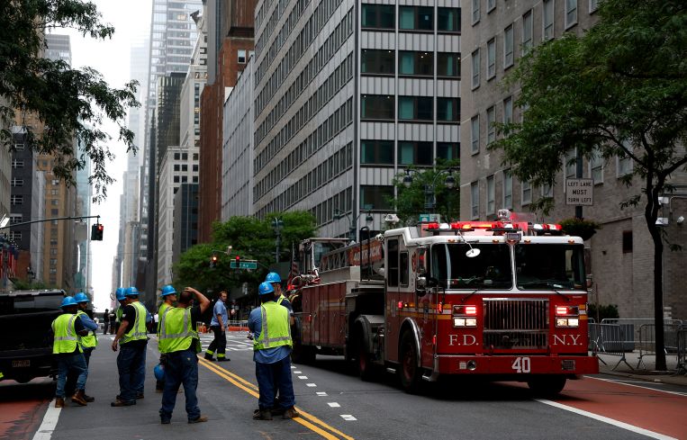 Emergency personnel work near the former Pfizer headquarters building on July 7.