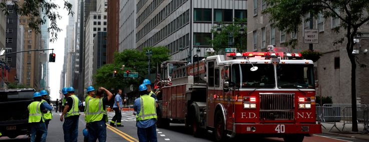 Emergency personnel work near the former Pfizer headquarters building on July 7.