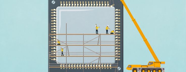 Crane and construction workers on scaffolding assembling semiconductor chip