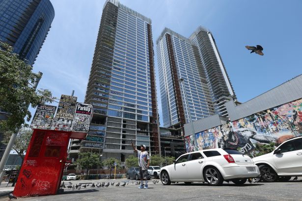 Oceanwide Plaza in Downtown Los Angeles, California, on July 24. Oceanwide Plaza, nicknamed the ''Graffiti Towers,'' has new ownership: KPC Square, a joint venture between KPC Group and Lendlease. KPC Square has started the process of removing graffiti from the skyscraper. 