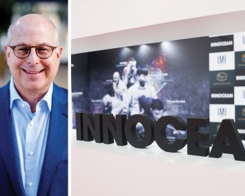 Hackman Capital Partners' Michael Hackman and the innocean booth at a forum.