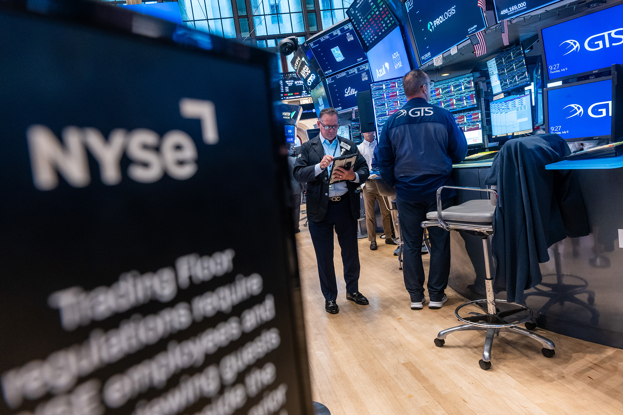 Traders work on the floor of the New York Stock Exchange.