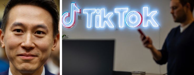 TikTok CEO Shou Zi Chew and an employee walking past the Tik Tok logo in one of the company's offices.