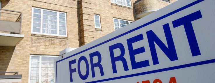 An apartment for rent sign.
