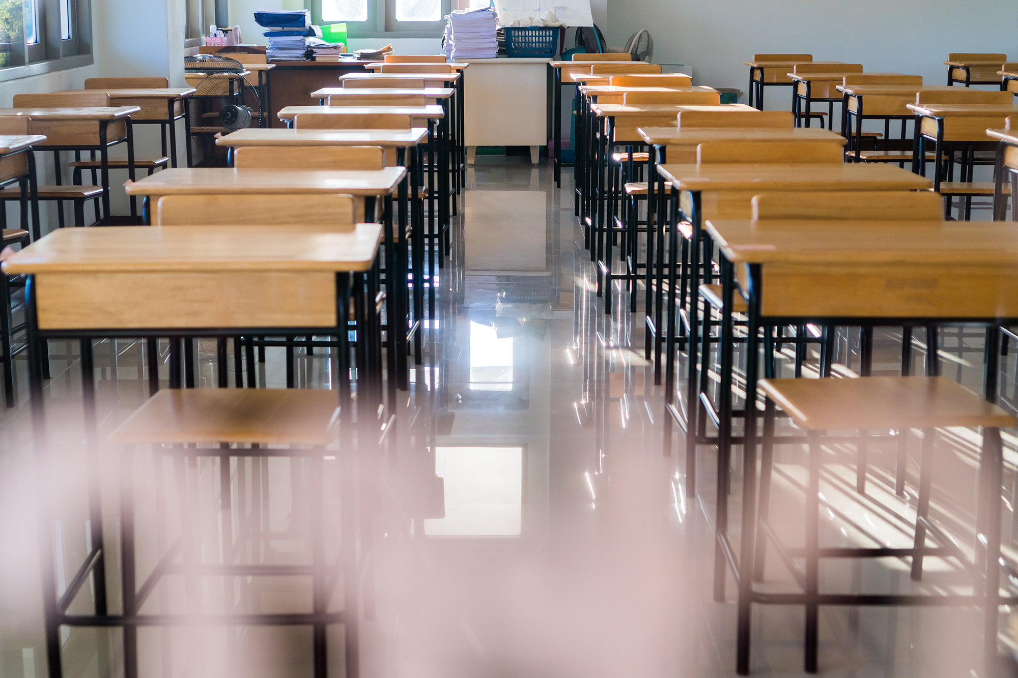 Rows of empty school desks.