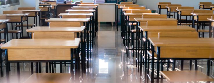 Rows of empty school desks.