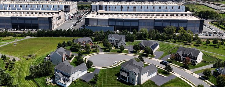 An Amazon Web Services data center stands near homes in Stone Ridge, Va., in August 2026.