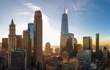 The scenic aerial view of the Liberty Tower over Manhattan Downtown includes the major skyscrapers: The Woolworth Building, Transportation Building, Barclay Tower, and more.