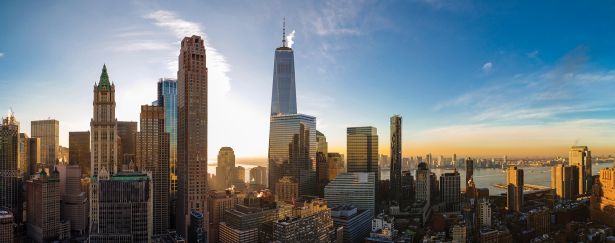 Lower Manhattan Has Become a Model for Other Urban Centers — Including Midtown The scenic aerial view of the Liberty Tower over Manhattan Downtown includes the major skyscrapers: The Woolworth Building, Transportation Building, Barclay Tower, and more.