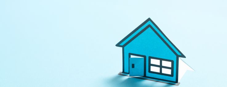 Illo of a blue paper model home against a vibrant blue background.