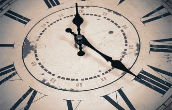 A close up of a vintage clock.