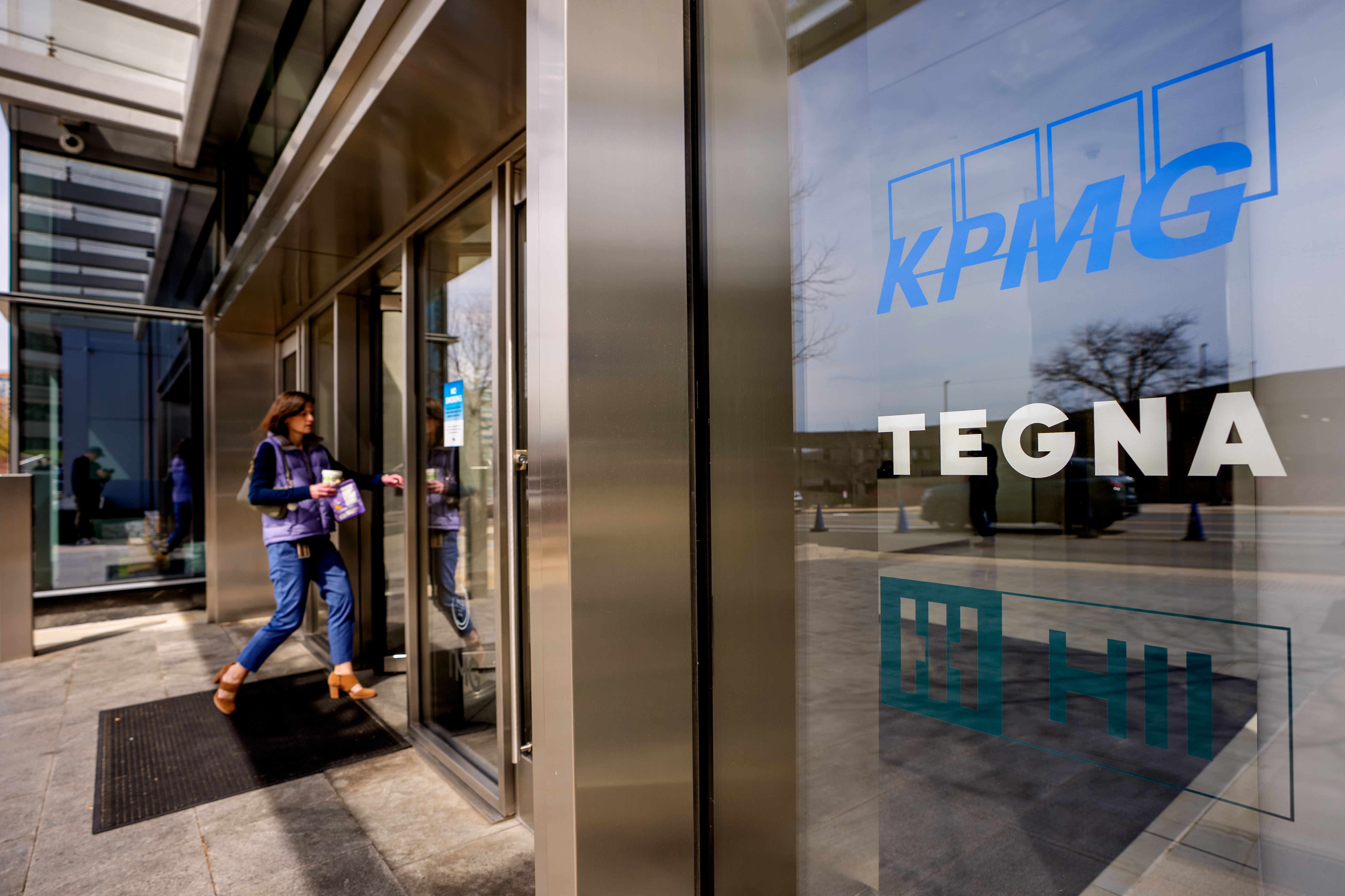 A person walks into an office building in Mclean, Virginia.