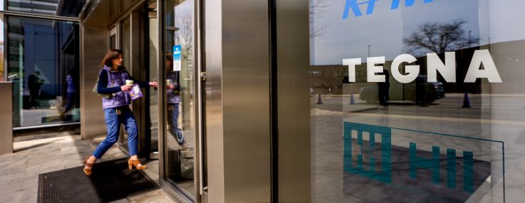 A person walks into an office building in Mclean, Virginia.