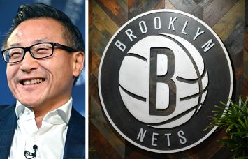 Brooklyn Nets owner Joseph Tsai and the team's logo inside the Brooklyn Nets HSS Training Center in Industry City, Brooklyn.