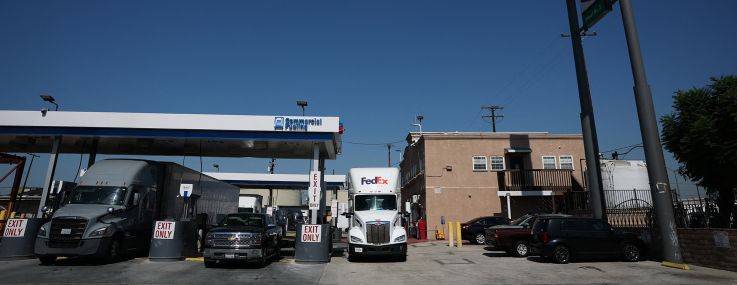 A driver parks a FedEx Freight truck near a diesel fuel pump station at a truck stop in Commerce, Calif.