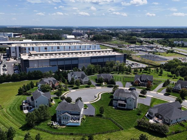 Welcome to Data Centerville, U.S.A.: How One Asset Class Changed Loudoun County, Va. An Amazon Web Services data center stands near several houses in Stone Ridge, Va.